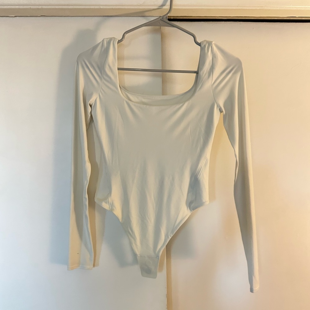Lululemon Athletica Cream Long Sleeve Bodysuit